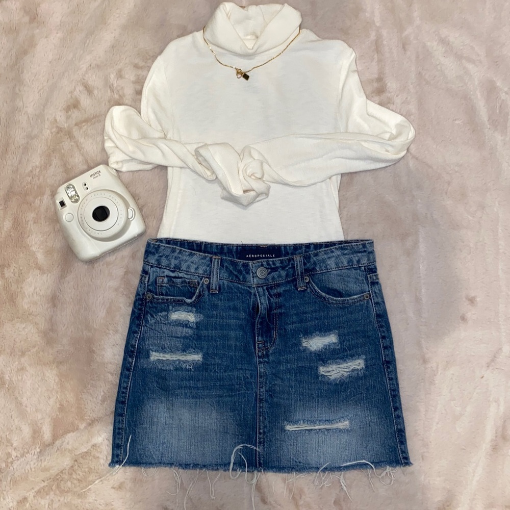 Distressed denim mini skirt